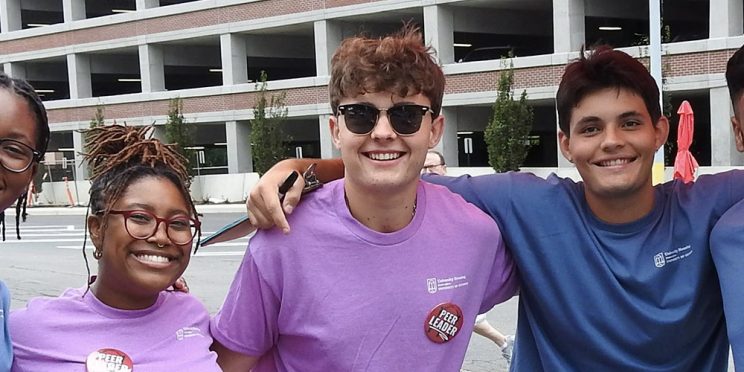 student volunteers smiling for the camera